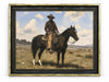 The Horseman framed art: a cowboy in a wide-brimmed hat seated on a dark horse in open grassland under a blue sky, in a dark frame with a distressed antiqued-gold edge