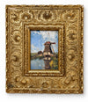 The Mill Pond giclée of a Dutch windmill reflected in still water under a blue sky, set in a deeply embossed antique gilt frame with floral and scroll detailing