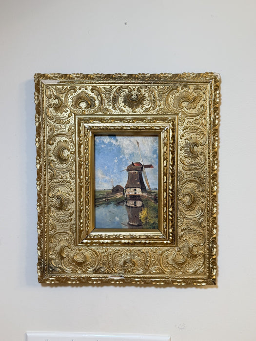 The Mill Pond in its ornate antique gilt frame hanging on a light wall