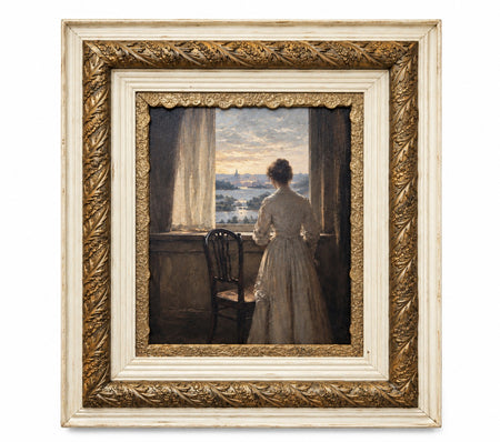 The Quiet Hour framed print of a woman in a pale dress standing at an open window overlooking a distant landscape, in a substantial cream-and-gilt carved frame