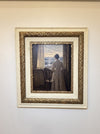 The Quiet Hour in its cream-and-gilt frame hanging on a soft white wall