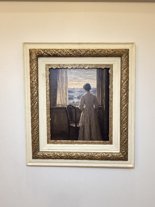 The Quiet Hour in its cream-and-gilt frame hanging on a soft white wall